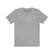 Load image into Gallery viewer, Unisex Jersey Short Sleeve Tee LD signature Cream Print